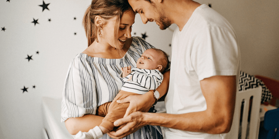 Parents holding an infant